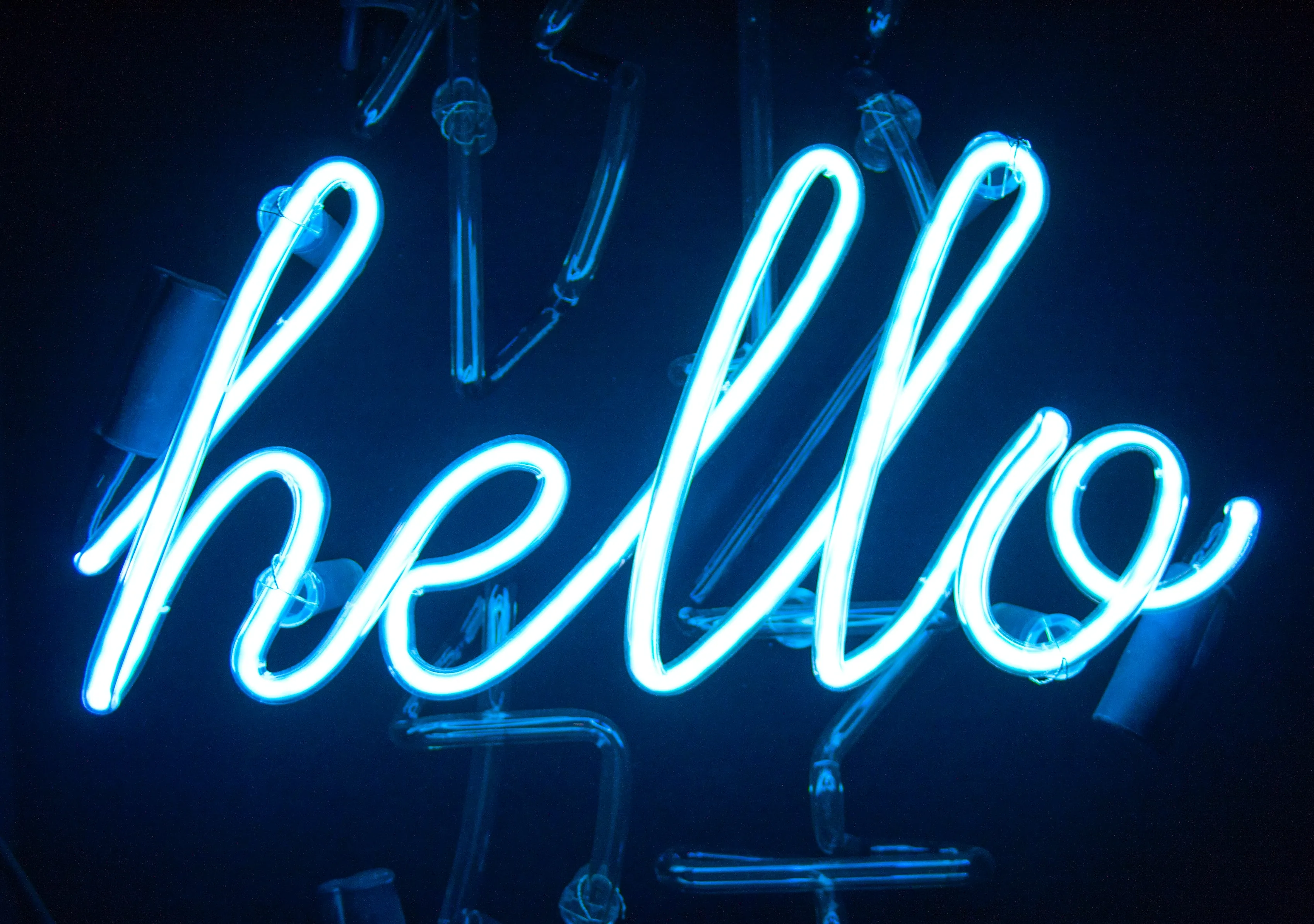 A blue neon sign saying 'hello'.